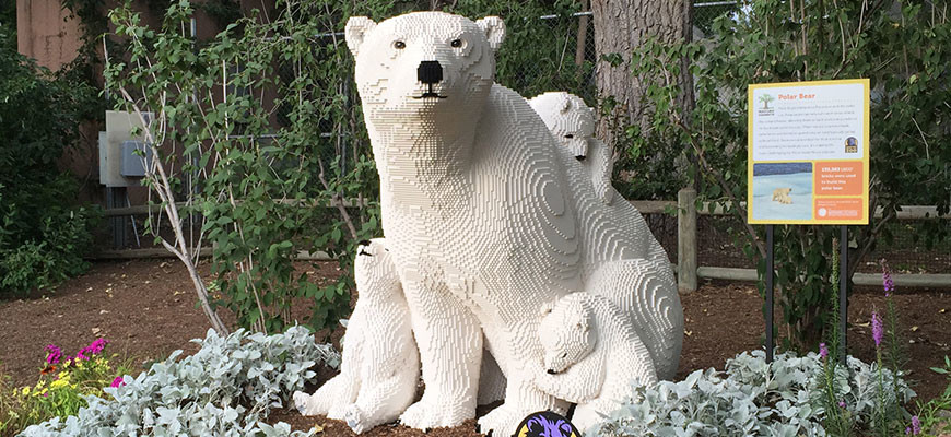 banner - Nature Connects - white/black lego brick sculpture of polar bear with 3 cubs
