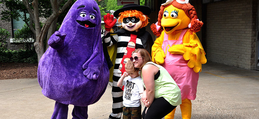 McDonald's Mother's Day at the Louisville Zoo - grimace, hamburglar, birdie, with child and mom posing for a photo on mother's day.