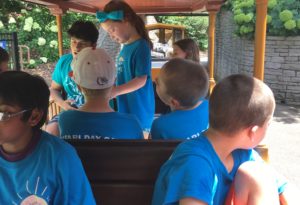 photo - Safari day campers, with counselors, riding underwater train on a sunny summer day
