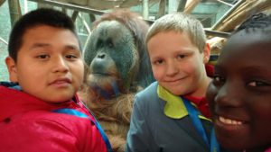 Goldsmith boys stand in front of Orangutan