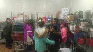 Goldsmith Students stand in the commissary