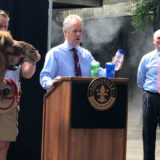 photo - mayor fischer, john walczak, jane anne franklin with camel, and the louisville zoo pure tap waater bottle refill station mascot, at a press conference