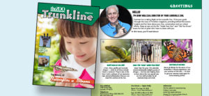 banner - l/side is cover of trunkline with info for butterflies and blooms, a new giraffe, mikki is expecting; r/side is page out of trunkline with john walczak holding baby wallaby, with 3 info shots of komodo dragon, titan the goat and a orange/black monarch butterfly