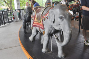 photo - carousel animal ride grey elephant, with decorative saddle, blankets