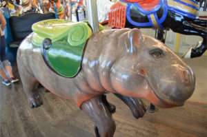 photo - carousel ride animal, grey/pink hippo, with yellow, lime green saddle