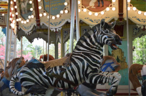 photo - carousel animal, zebra, white with black stripes