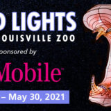 banner - Wild Lights, at the Louisville Zoo, sponsored by, T Mobile (logo), March 19 - May 30, 2021 in blue box with wild light pink hippo w/mouth open, teeth showing, protruding left eye, lite up from inside, with black backgound.