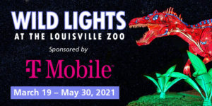 banner - Wild Lights, At The Louisville Zoo, sponsored by T-Mobile (logo), March 19 - May 30, 2021, with wild lites red dragon, mouth open showing teeth, with with green leafy blue colored markings over most of the body, ground bushes, and grass on right side of banner