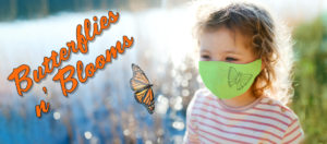banner - Butterflies n' Blooms, with female child wearing green mask, w/butterfly print, watching monarch butterfly hovering