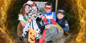 Family in costume with gold GIF banner