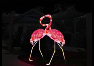 graphic - two pink and white flamingos with necks entwined to form a heart design