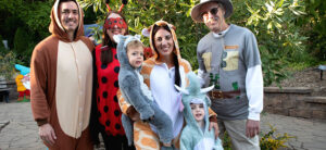 photo of family dressed in costumes as safari animals with guide for boo at the zoo