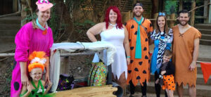 photo of family dressed as the flintstones family and pet dragon for boo at the zoo