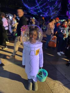 Child on the plaza at Boo at the Zoo dressed as Sandy Cheeks from Spongebob Squarepants.